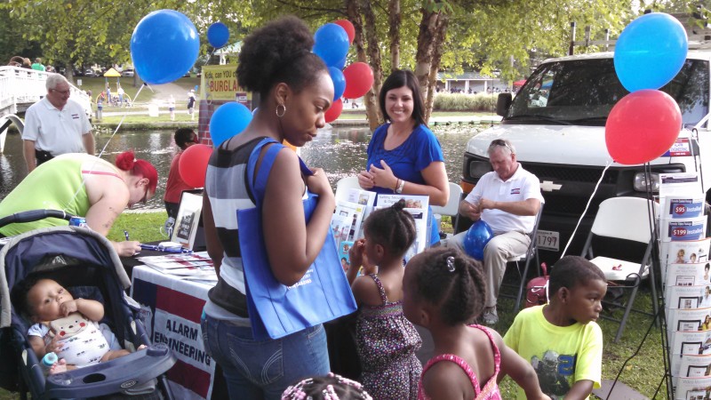 Jodi Garvin having fun with some excited little ones while Doug Brown keeps up on the balloon demand.